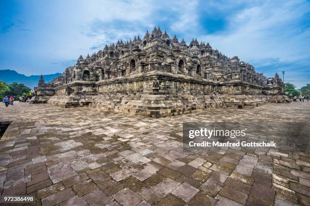 corner view of the mandala step pyramid of 9th century borobudur buddhist temple, central java, indonesia - borobudur temple stock pictures, royalty-free photos & images