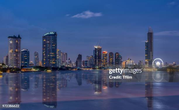 bangkok business building with reflection near chao praya river in sunset time - praya stock pictures, royalty-free photos & images