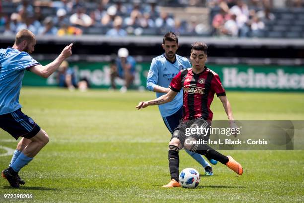 Miguel Almiron of Atlanta United kicks the ball through NYCFC defense during the match between New York City FC and Atlanta United FC at Yankee...