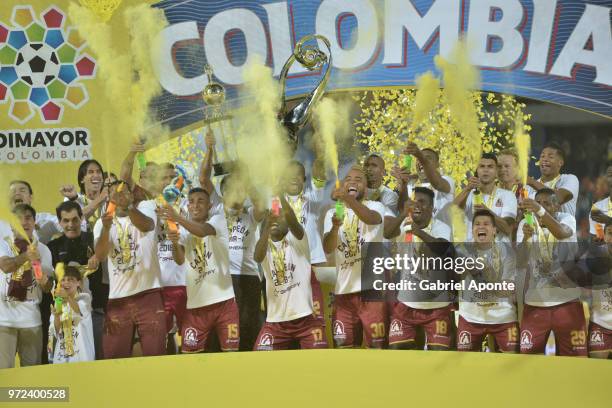 Players of Tolima lift the trophy to celebrate as champions of the Liga Aguila I 2018 after the second leg match between Atletico Nacional and...