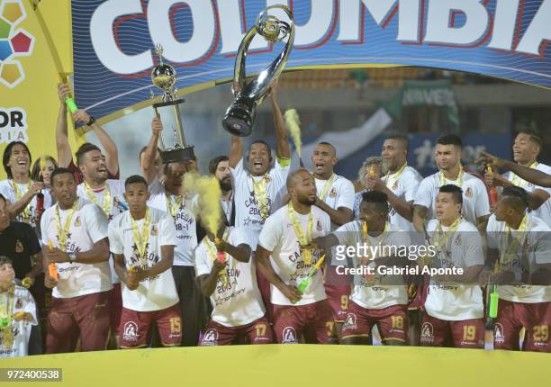 Players of Tolima lift the trophy to celebrate as champions of the Liga Aguila I 2018 after the second leg match between Atletico Nacional and...