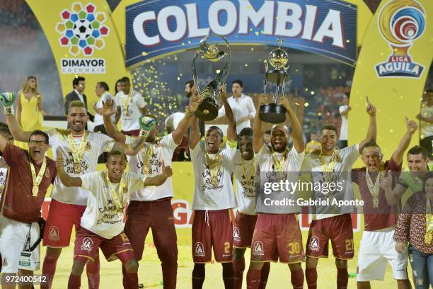 Fainer Torijano and Luis Payares of Tolima lift the trophy to celebrate as champions of the Liga Aguila I 2018 after the second leg match between...