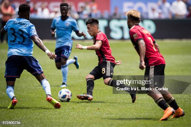 Ezequiel Barco of Atlanta United uses some footwork to get past NYCFC defenders during the match between New York City FC and Atlanta United FC at...