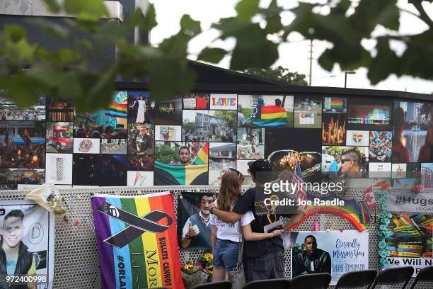 Jillienne Riethmiller and Zachary Guadalupe spend time at the memorial set up for the shooting victims at Pulse nightclub where the shootings took...