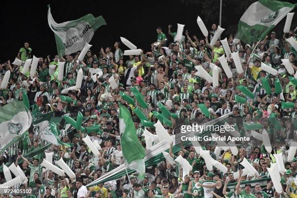 Fans of Nacional cheer for their team during the second leg match between Atletico Nacional and Deportes Tolima as part of the Liga Aguila I final on...