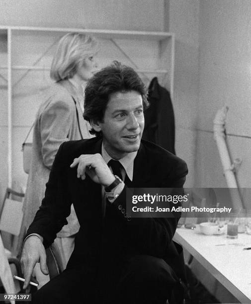 Fashion designer Calvin Klein poses for a portrait backstage before a fashion show for People Magazine in 1979 in Los Angeles, California.