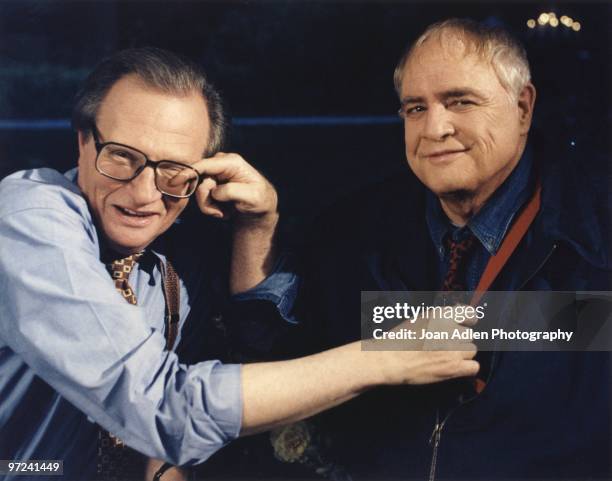 Actor Marlon Brando plants one on talk show host Larry King during the taping of "The Larry King Show' taped at Brando's house in Coldwater Canyon on...