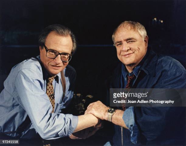 Actor Marlon Brando plants one on talk show host Larry King during the taping of "The Larry King Show' taped at Brando's house in Coldwater Canyon on...