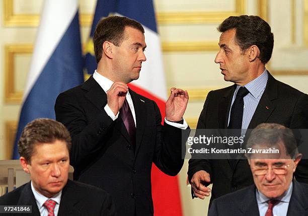 Russian President Dmitry Medvedev and France's President Nicolas Sarkozy stand behind head of Russian Gazprom State Company Alexei Miller and French...
