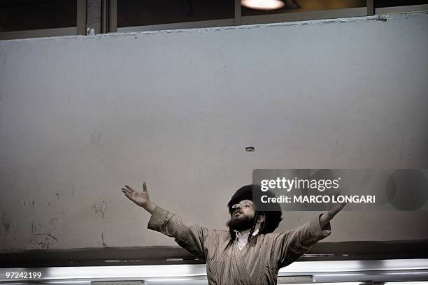 An Ultra-Orthodox man dances while taking part in celebrations of the Jewish feast of Purim at a synagogue in Jerusalem's conservative Mea Shearim...