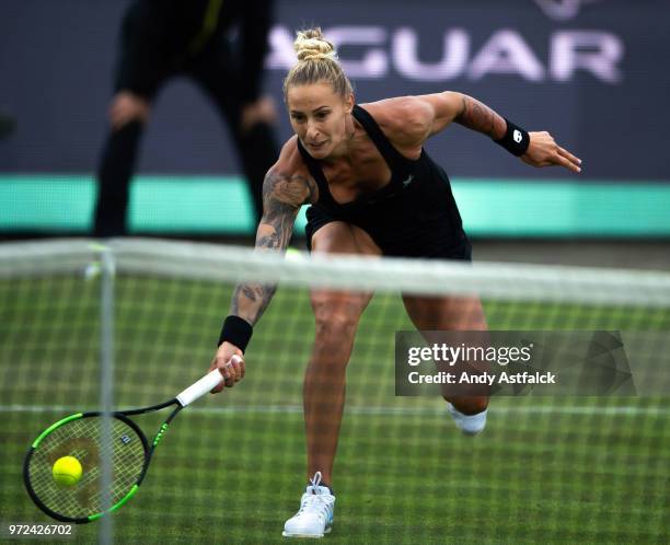Polona Hercog from Slovania stretches to return a shot to Elise Mertens from Belgium during their First Round, Ladies Singles Match on Day Two of the...