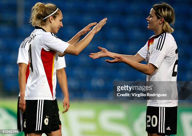 Babett Peter and Jennifer Jietz celebrate the goal of Germany during the Woman Algarve Cup match between Germany and China at the Estadio Algarve on...