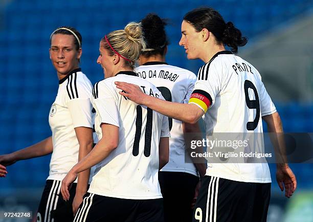 Anja Mittag and Birgit Prinz celebrate the goal of Germany during the Woman Algarve Cup match between Germany and China at the Estadio Algarve on...