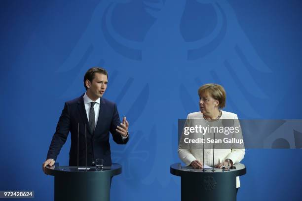 German Chancellor Angeka Merkel and Austrian Chancellor Sebastian Kurz speak to the media following talks at the Chancellery on June 12, 2018 in...