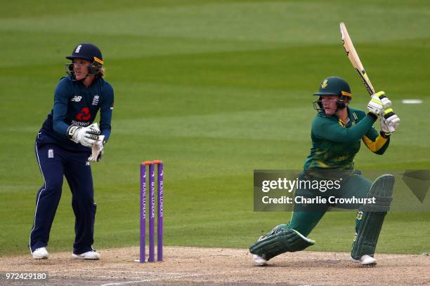 Lizelle Lee of South Africa hits out while Sarah Taylor of England watches on during the ICC Women's Championship 2nd ODI match between England Women...