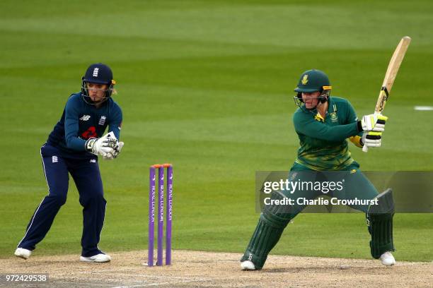 Lizelle Lee of South Africa hits out while Sarah Taylor of England watches on during the ICC Women's Championship 2nd ODI match between England Women...