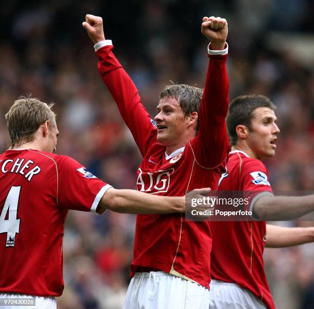 Ole Gunnar Solskjaer of Manchester United celebrates with teammates after scoring a goal during the Barclays Premiership match between Manchester...