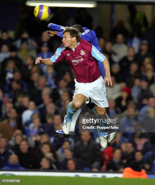 Geremi of Chelsea battles for the ball with Teddy Sheringham of West Ham United during the Barclays Premiership match between Chelsea and West Ham...