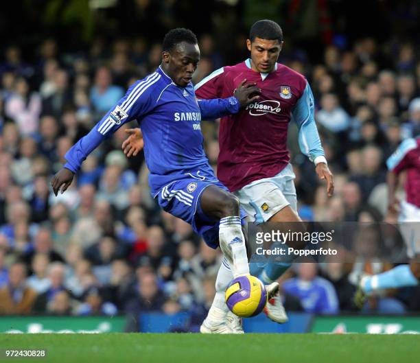 Michael Essien of Chelsea is challenged by Hayden Mullins of West Ham United during the Barclays Premiership match between Chelsea and West Ham...