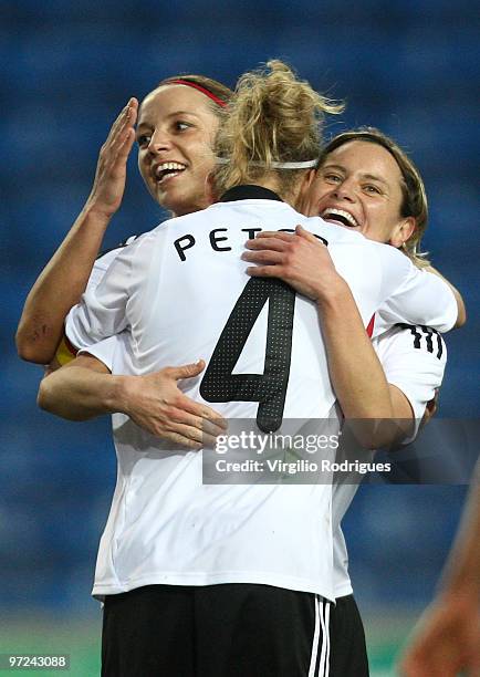 Martina Mueller and Babett Peter of Germany celebrate the goal during the Woman Algarve Cup match between Germany and China at the Estadio Algarve on...