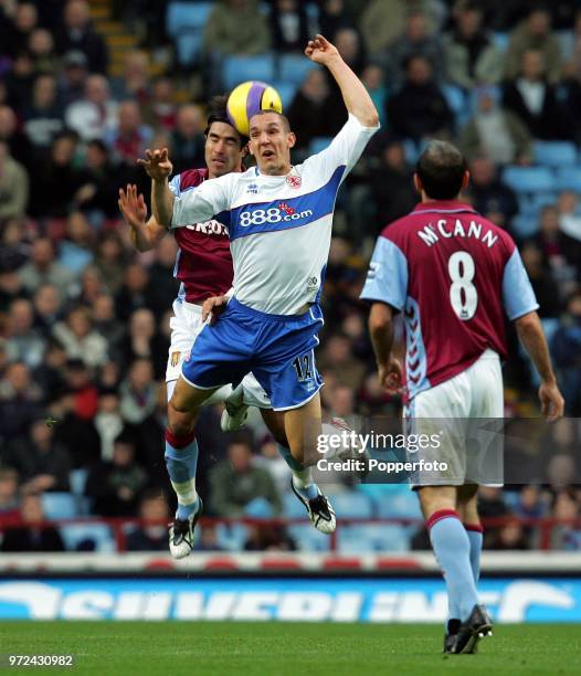 Emmaneul Pogatetz of Middlesbrough battles with Juan Pablo Angel of Aston Villa during the Barclays Premiership match between Aston Villa and...