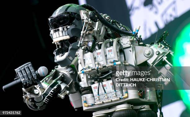 The 'singer' of the robots' band "Compressorhead" stands on the stage during the Cebit technology fair in Hanover, Germany on June 12, 2018. - The...