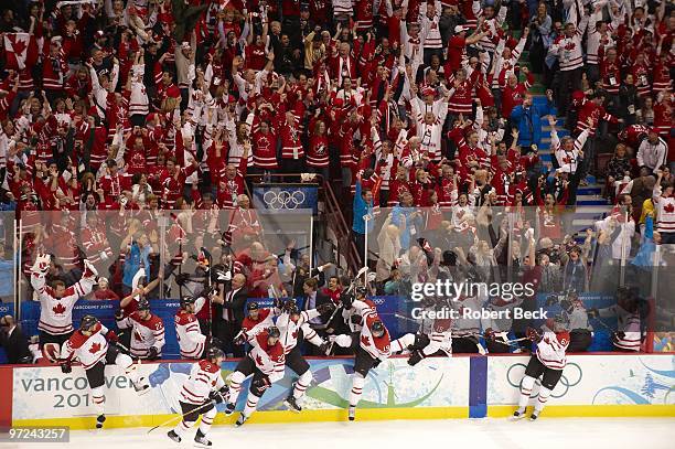 Winter Olympics: View of Team Canada bench victorious, celebration after game winning, overtime goal by Sidney Crosby vs USA during Men's Gold Medal...