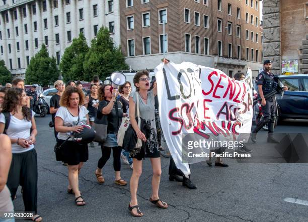 Protesters holding a banner during a demonstration under the Minister of Transport in Rome for the opening of Italian ports in the Emergency for the...