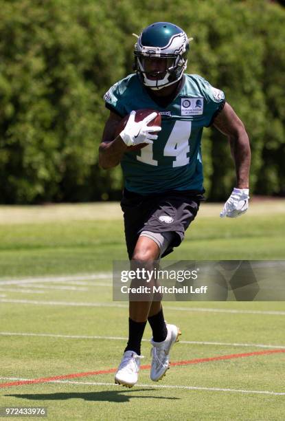 Mike Wallace of the Philadelphia Eagles runs with the ball during Eagles minicamp at the NovaCare Complex on June 12, 2018 in Philadelphia,...