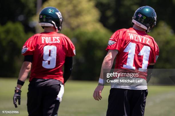 Nick Foles and Carson Wentz of the Philadelphia Eagles look on during Eagles minicamp at the NovaCare Complex on June 12, 2018 in Philadelphia,...