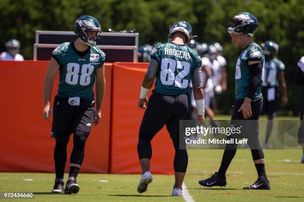 Dallas Goedert, Richard Rodgers, and Zach Ertz of the Philadelphia Eagles talk during Eagles minicamp at the NovaCare Complex on June 12, 2018 in...