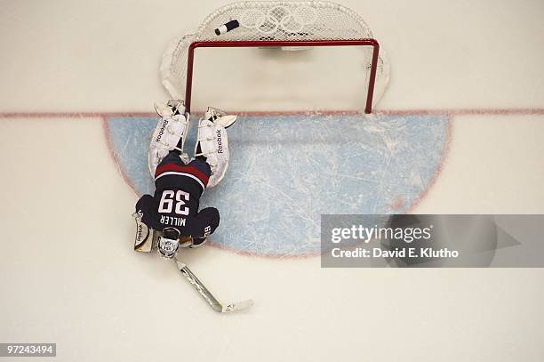 Winter Olympics: Aerial view of USA goalie Ryan Miller upset after yielding game winning goal by Canada Sidney Crosby in overtime during Men's Gold...