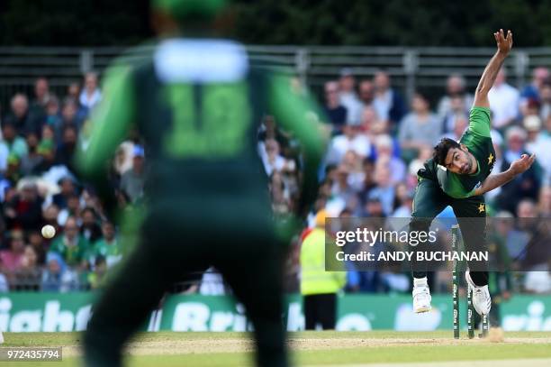 Pakistan's Hussain Talat bowls during the first Twenty20 International cricket match between Scotland and Pakistan at the Grange Cricket Club in...