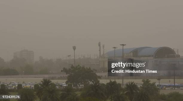 City skyline seen engulfed with thick dust particles at Akshardham flyover, on June 12, 2018 in New Delhi, India. Dust pollution in New Delhi has...