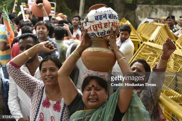 Delhi BJP Yuva Morcha workers protest against Delhi chief minister Arvind Kejriwal on the issue of Delhi water crisis, outside Lt Governor's...