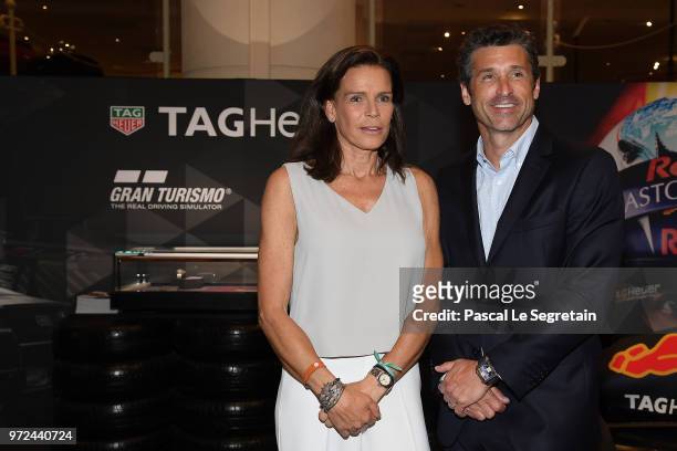 Princess Stephanie of Monaco poses with TAG Heuer Ambassador and actor Patrick Dempsey, during a visit to the Car Collection of Prince Albert of...