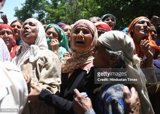Relatives mourn the death of Ghulam Hassan Wagay during his funeral at Vohlutra Rafiabad on June 12, 2018 in Baramulla, India. Wagay along with...