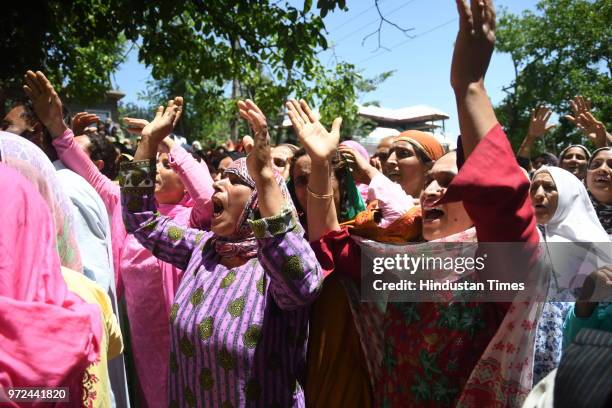 Relatives mourn the death of Ghulam Hassan Wagay during his funeral at Vohlutra Rafiabad on June 12, 2018 in Baramulla, India. Wagay along with...