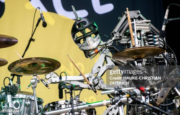 The 'drummer' of the robots' band "Compressorhead" stands on the stage during the Cebit technology fair in Hanover, Germany on June 12, 2018. - The...