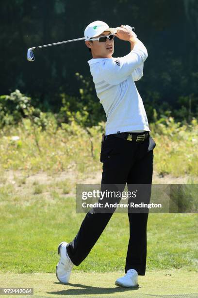 Haotong Li of China plays a shot during a practice round prior to the 2018 U.S. Open at Shinnecock Hills Golf Club on June 12, 2018 in Southampton,...