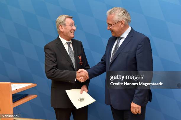 Karl Hopfner, CFO of FC Bayern Muenchen, and Bavarian Interior Minister Joachim Herrmann during Karl Hopfner Is Awarded With The Federal Cross of...