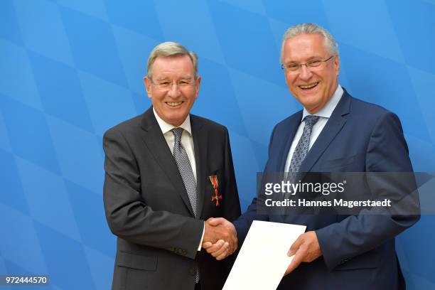 Karl Hopfner, CFO of FC Bayern Muenchen, and Bavarian Interior Minister Joachim Herrmann during Karl Hopfner Is Awarded With The Federal Cross of...