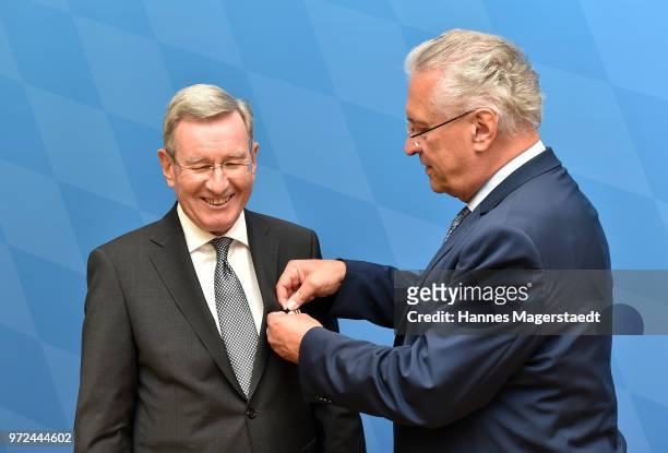 Karl Hopfner, CFO of FC Bayern Muenchen, and Bavarian Interior Minister Joachim Herrmann during Karl Hopfner Is Awarded With The Federal Cross of...
