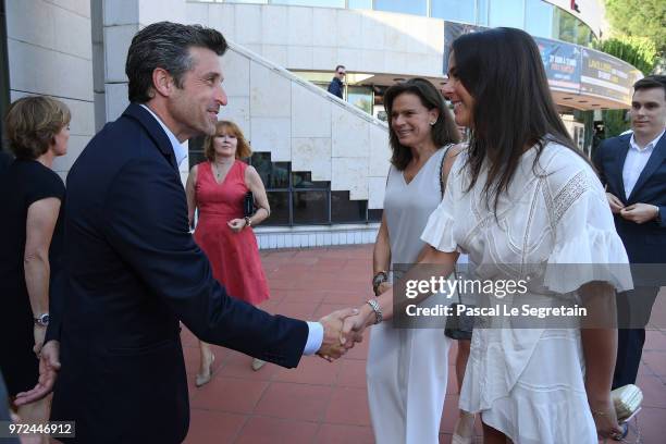 Heuer Ambassador and actor Patrick Dempsey greets Pauline Ducruet during a visit to the Car Collection of Prince Albert of Monaco and inaugurate the...