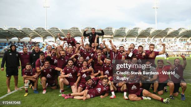 The Georgia players celebrate their victory over Japan after the 9th Place semi final match between Georgia and Japan at Stade Aime-Giral on June 12,...