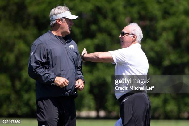 Head coach Doug Pederson of the Philadelphia Eagles talks to owner Jeffrey Lurie after Eagles minicamp at the NovaCare Complex on June 12, 2018 in...