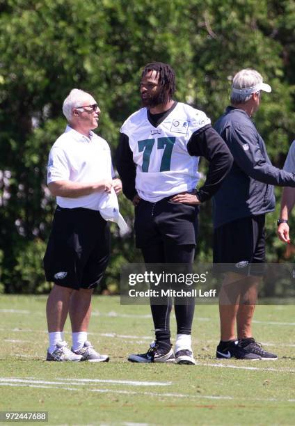 Philadelphia Eagles owner Jeffrey Lurie talks to Michael Bennett of the Philadelphia Eagles after Eagles minicamp at the NovaCare Complex on June 12,...