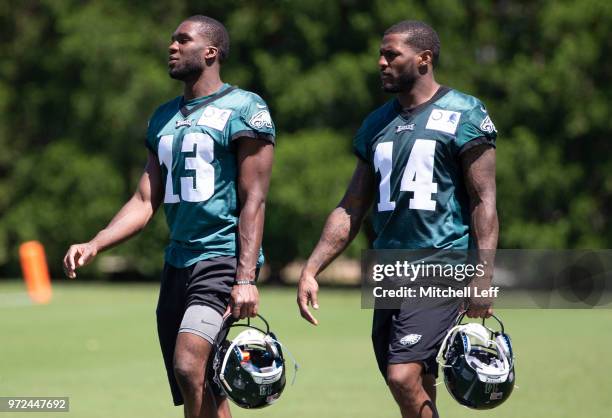 Nelson Agholor and Mike Wallace of the Philadelphia Eagles walk off the field after Eagles minicamp at the NovaCare Complex on June 12, 2018 in...