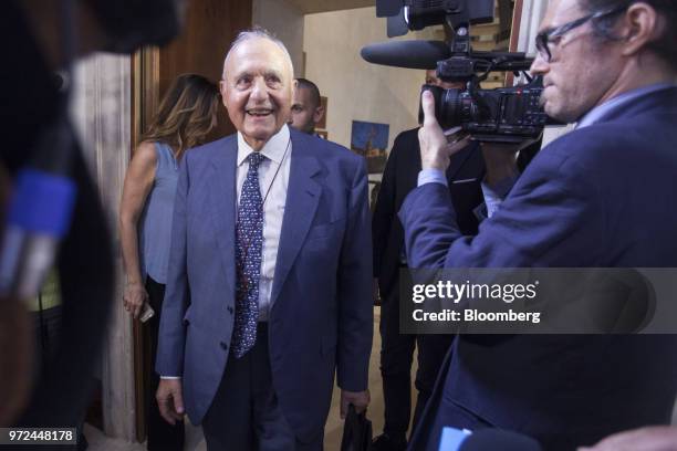 Paolo Savona, Italy's European affairs minister, center, arrives for a launch party for his book, entitled "Like A Nightmare And Like A Dream," in...