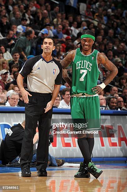 Referee Zach Zarba and Marquis Daniels of the Boston Celtics stand on the court during the game between the Celtics and the Denver Nuggets on...